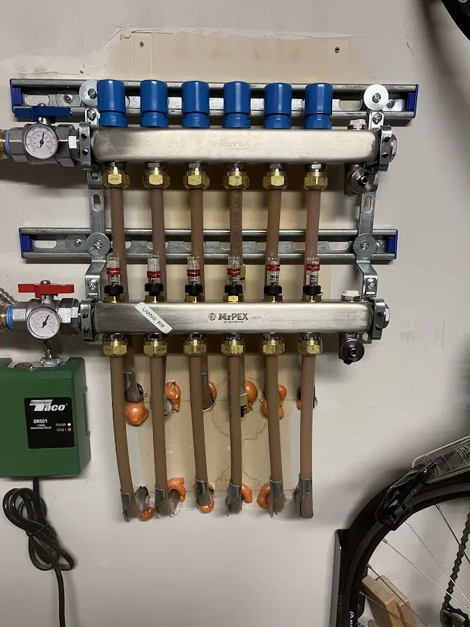 Plumber performing Water Heater Repair at a residential property in Coshocton